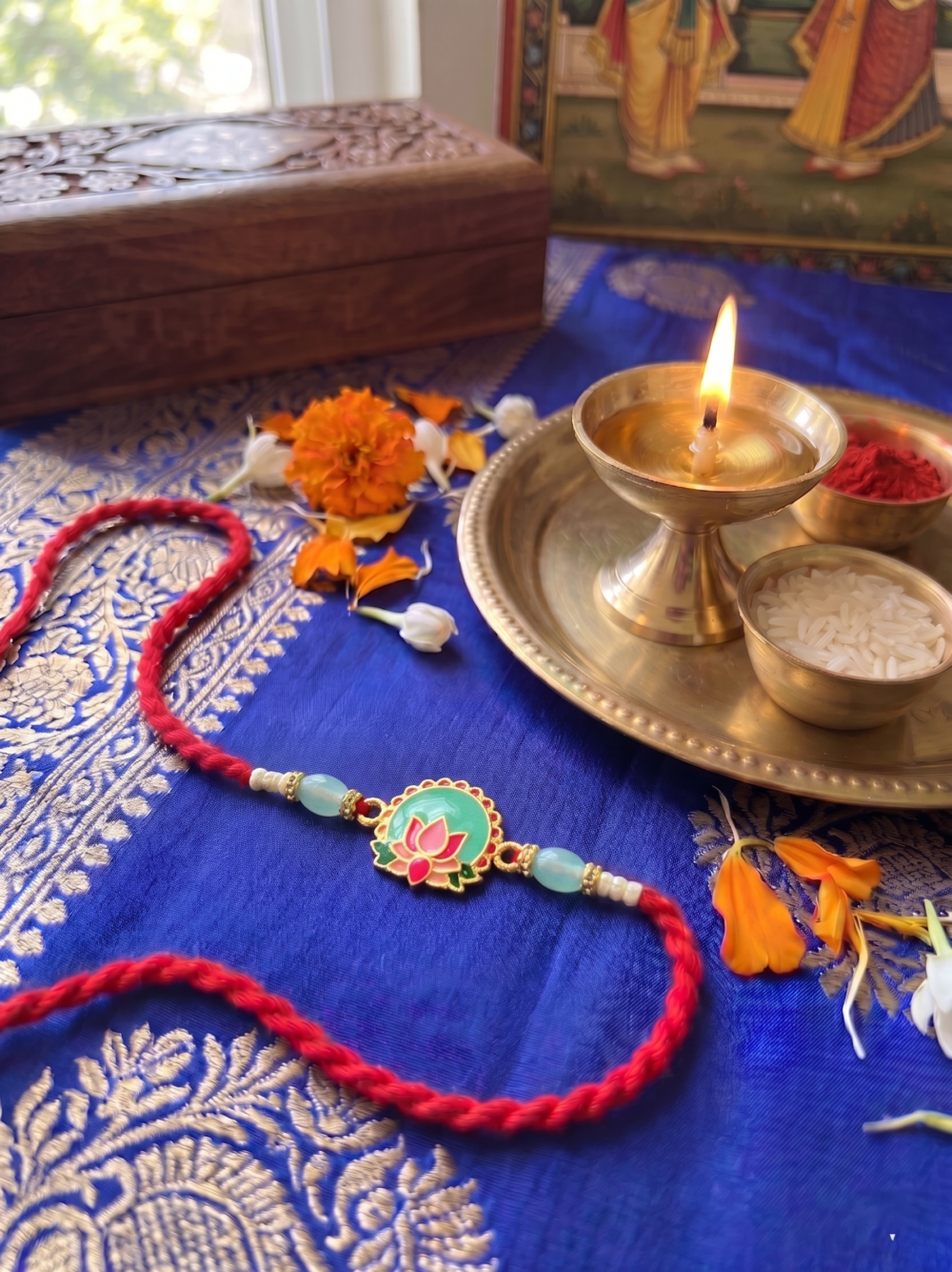 Elegant Pink Lotus Rakhi with Soft Red Braided Thread